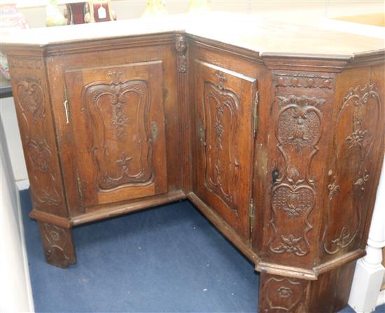 An 18th century French oak corner armoire, W.5ft 8in. D.1ft 10in. H.3ft 9in.